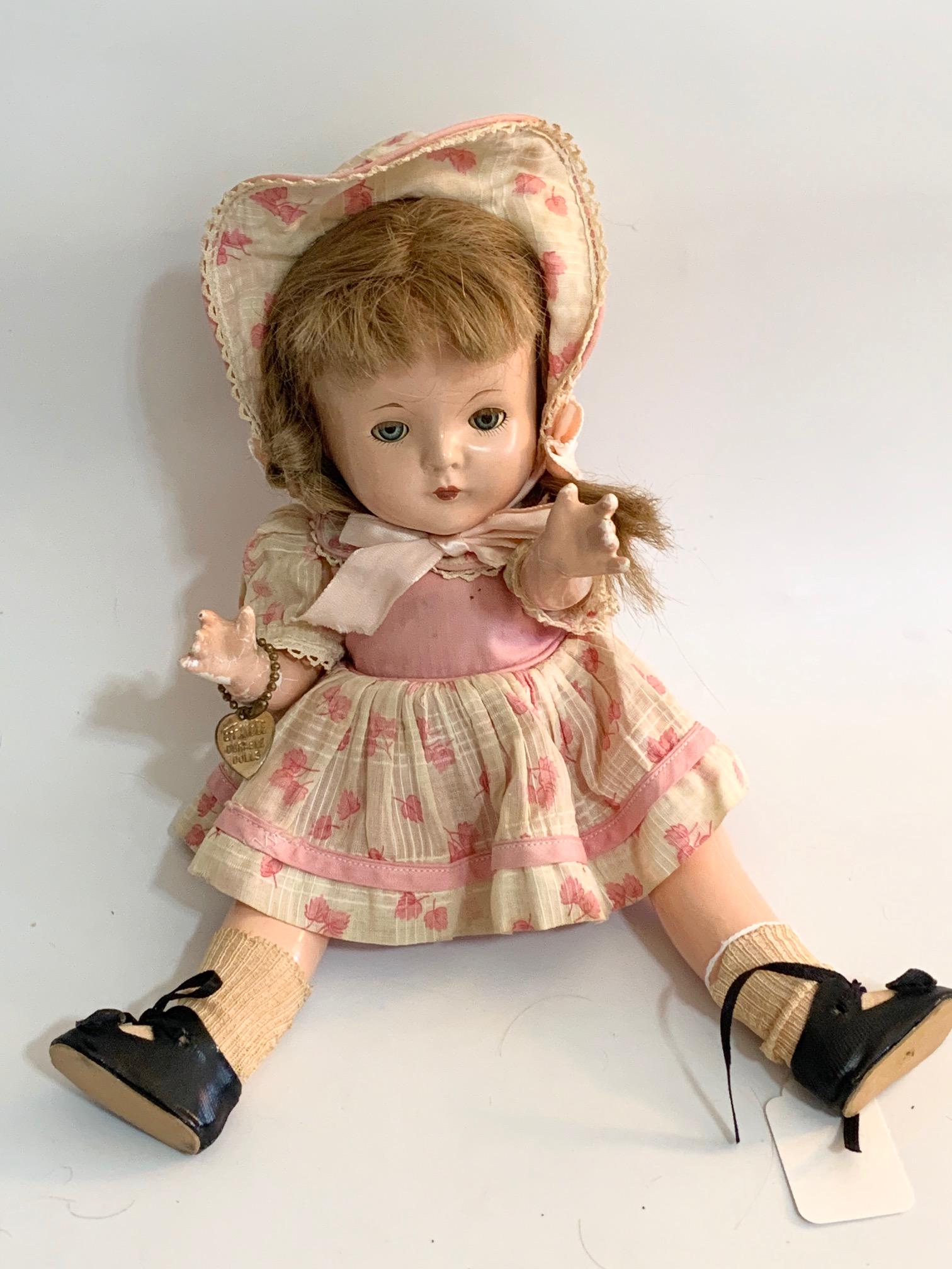 B13: Effanbee Patricia Kin 11" Composition Doll: Effanbee Patricia Kin 11" Composition doll; sleep eyes with heart tag; all original. We do our best to list all possible flaws, these are vintage/antique dolls and are NOT perfect. Please refer to the