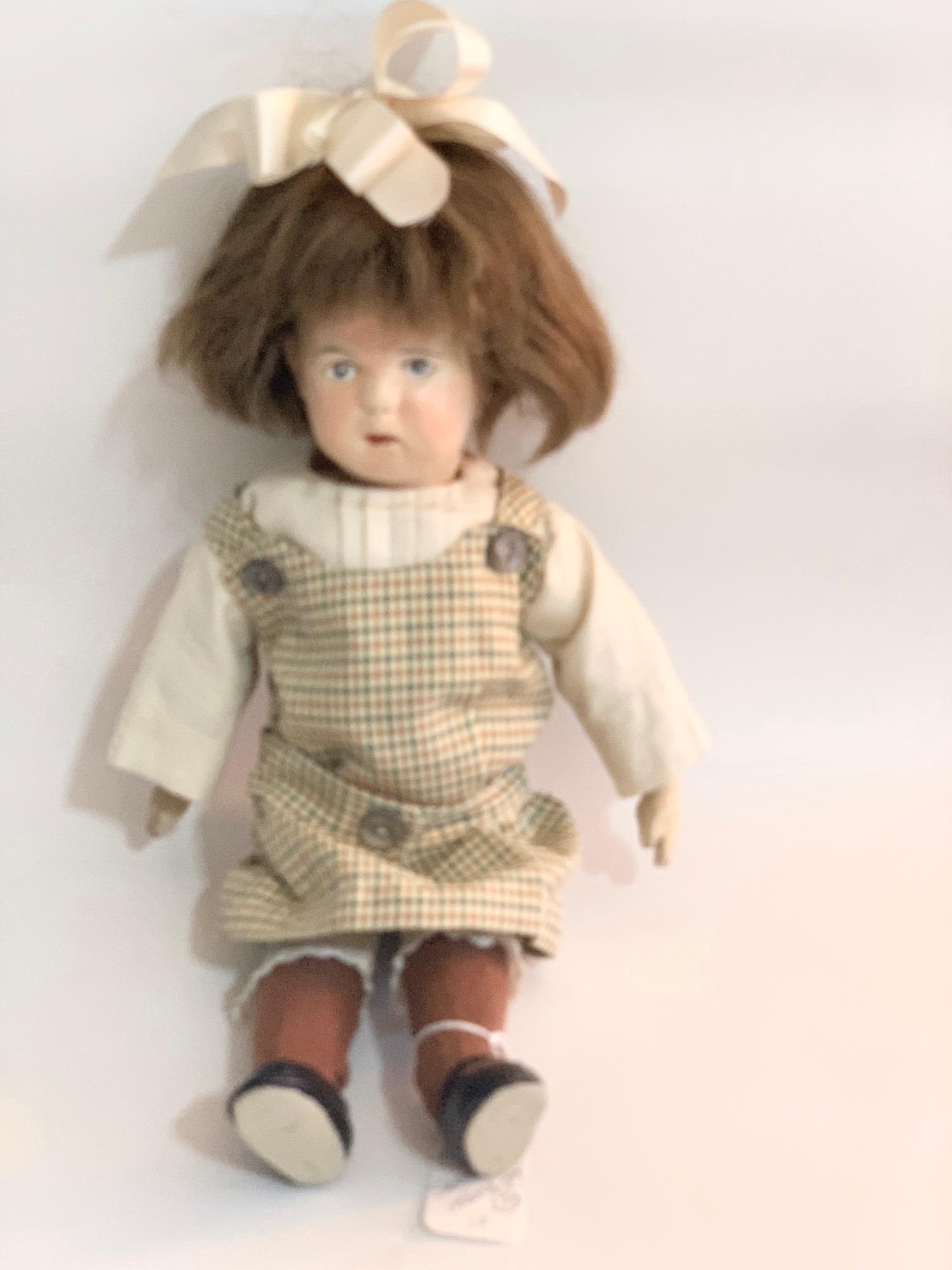 B13: Schoenhut 14" Doll Repaired: Schoenhut 14" Doll Repaired and Repainted; replaced outfit and wig. We do our best to list all possible flaws, these are vintage/antique dolls and are NOT perfect. Please refer to the photos as part o