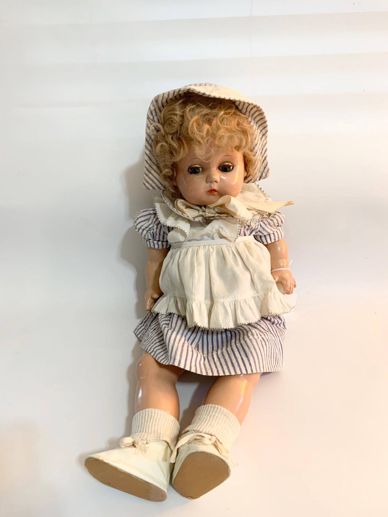 B14:: Chubby Toddler 19" Composition Doll: Chubby Toddler 19" Composition Doll; probably replaced ble and white seersucker dress with bonnet; needs to be restrung. We do our best to list all possible flaws, these are vintage/antique dolls and 