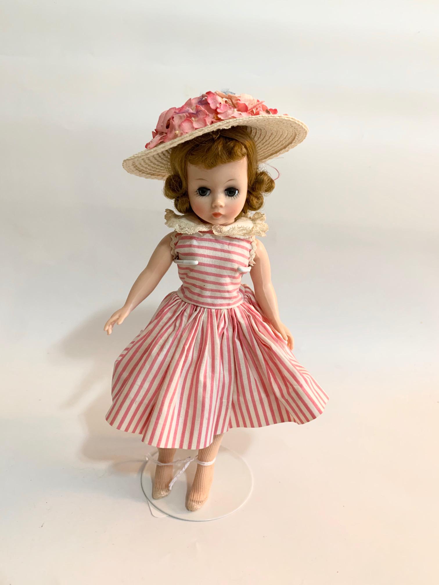 B15: Madame Alexander Cissette 9" Doll: Madame Alexander Cissette 9" Doll; original tagged pink and white dress; original underwear. We do our best to list all possible flaws, these are vintage/antique dolls and are NOT perfect. Please refe