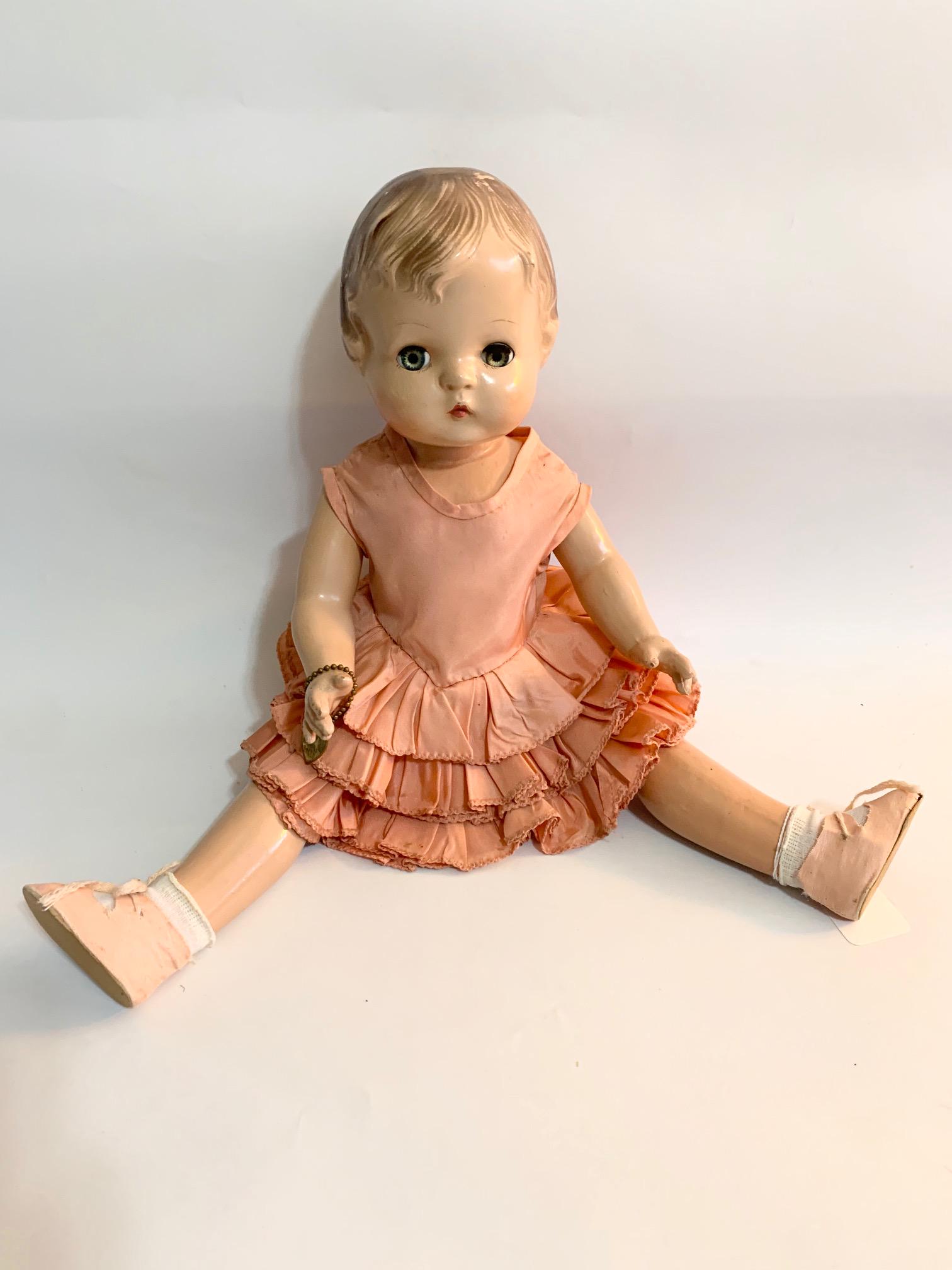 B17: Effanbee Patsy #18 17" Doll: Effanbee patsy #18 17" Doll; has heart bracelet;old each taffeta dress; dress marked as 18; old shoes and original wig. We do our best to list all possible flaws, these are vintage/antique dolls and a