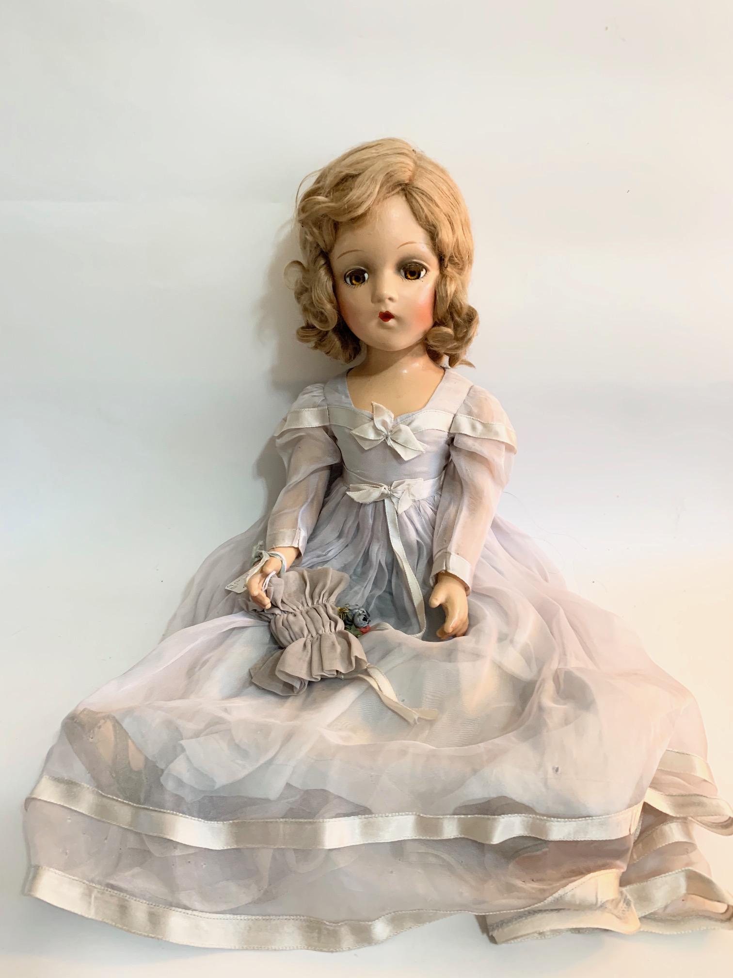 B-18 Madame Alexander Lavender Blue Bridesmaid Wendy: Madame Alexander Lavender/Blue Bridesmaid with a Wendy Face; 21" composition; original tagged pale lavender/blue dress with some damage; old Effanbee shoes; original blonde wig. We do our best to list