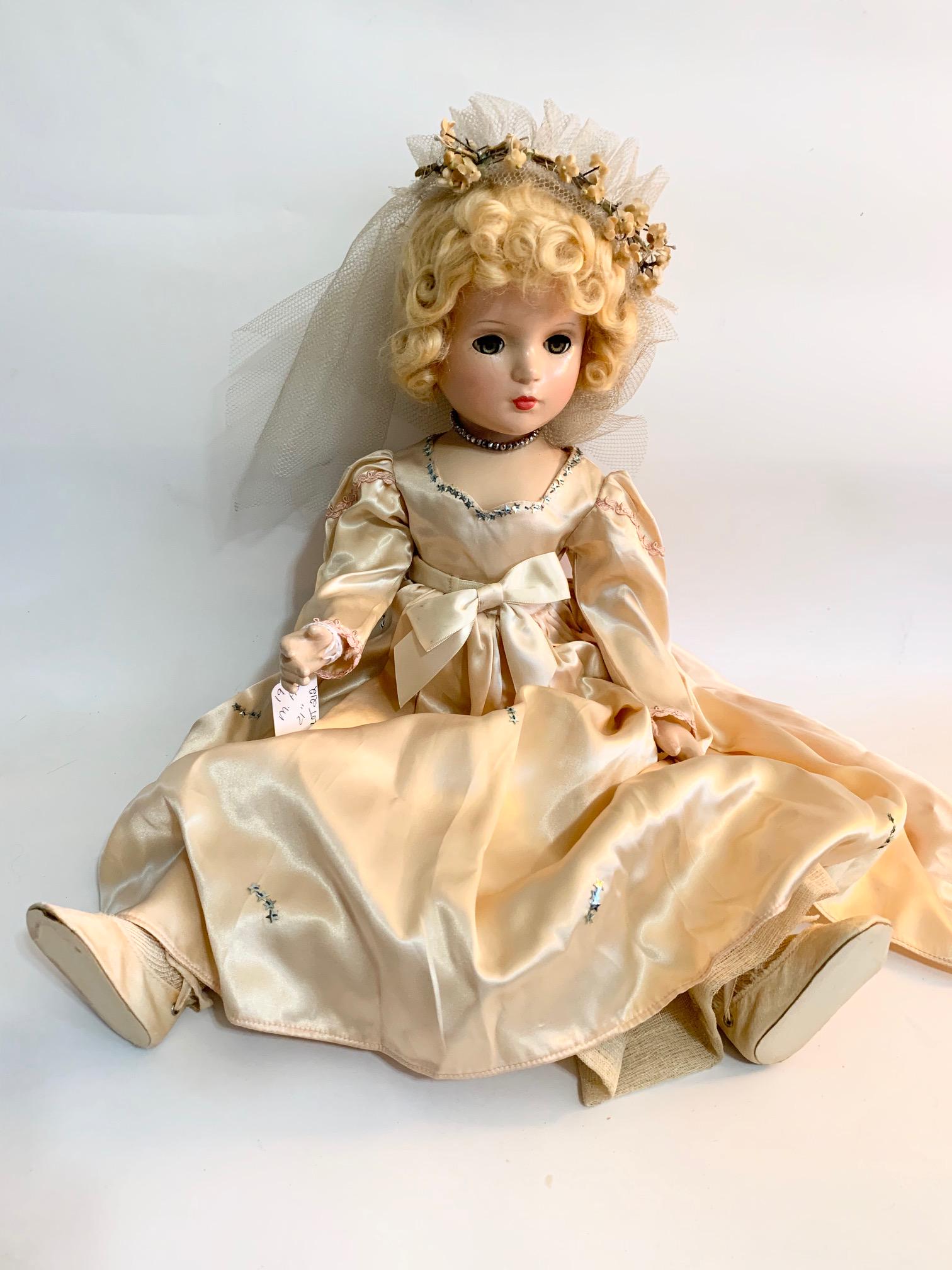 B-18: Madame Alexander Bridesmaid 1940's Wendy Face: Madame Alexander Bridesmaid 21" composition from the 1940's Bridal Party series; Wendy face; has crack up back of neck; repainted face; original peach satin gown decorated with stars (may hav been add