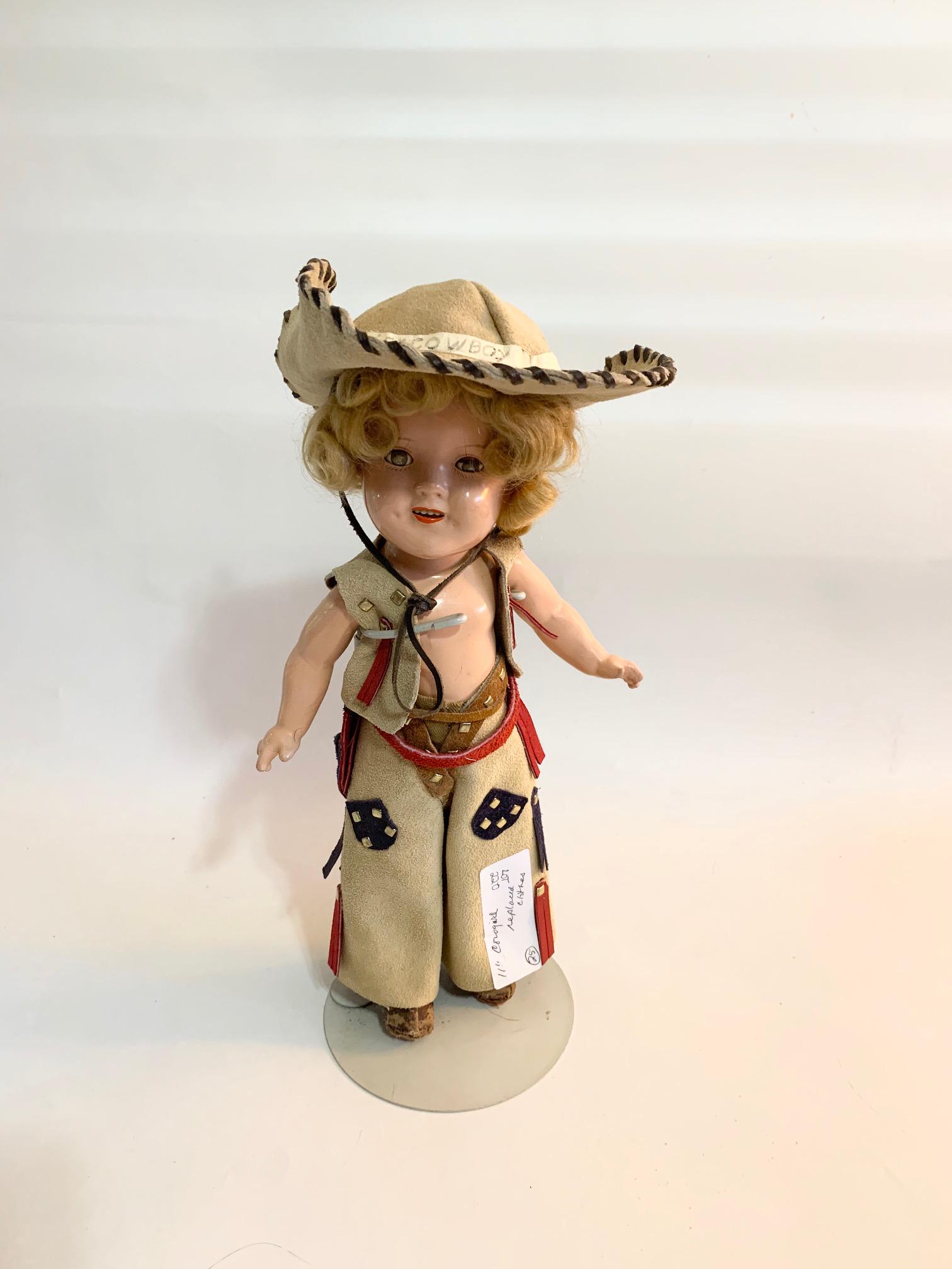 B-19: Shirley Temple Cowgirl 11" Composition Doll: Shirley Temple Cowgirl 11" Composition Doll; replaced vest, chaps and hat, no shirt; boots original but in poor condition. We do our best to list all possible flaws, these are vintage/antique dolls an