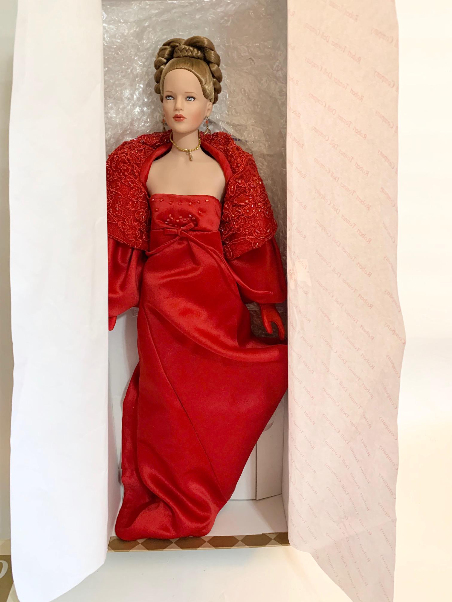 Regina-1999 Tonner Doll Limited Edition: 1999 Limited Edition Tonner Regina Doll; 19" with original box and tag. Number 243 of 500; Original red fashion long gown with capelet jacket. We do our best to list all possible flaws, these are vint