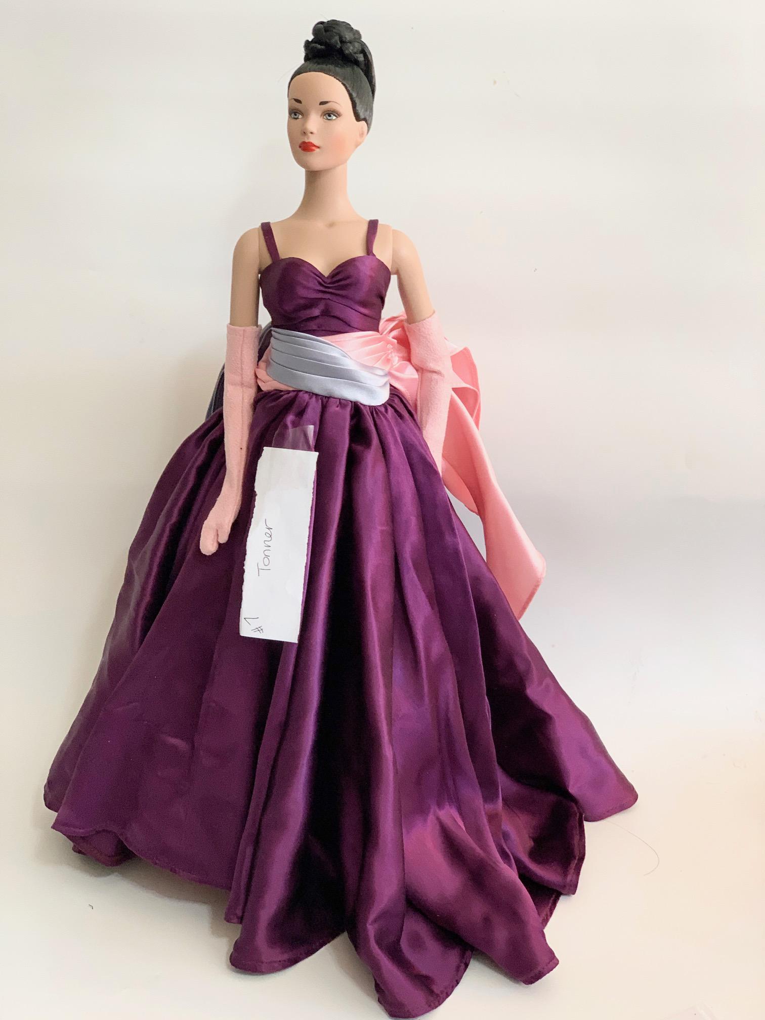 FB-15" Tonner Doll Purple Spaghetti Straps: 15" Tonner Doll with original purple spaghetti strap dress with Pink and lue ribbon waistband; no shoes; dark brown hair in a bun. We do our best to list all possible flaws, these are vintage/antique 