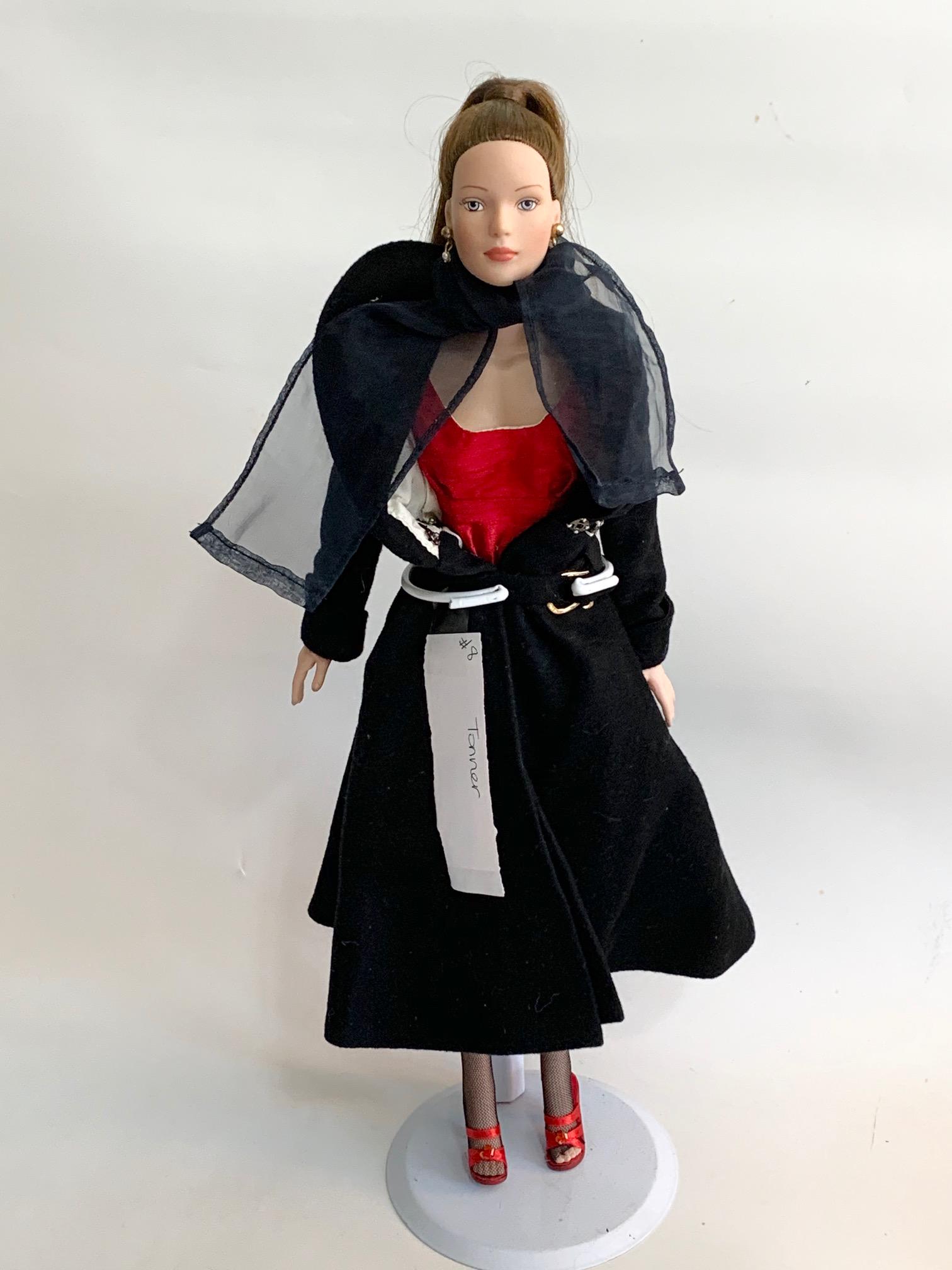 FB-15" Tonner Doll Red Dress/Black Coat: 15" Tonner Doll with original red dress with black coat; original red strap shoes and stockings; long dark pony tail. We do our best to list all possible flaws, these are vintage/antique dolls and are