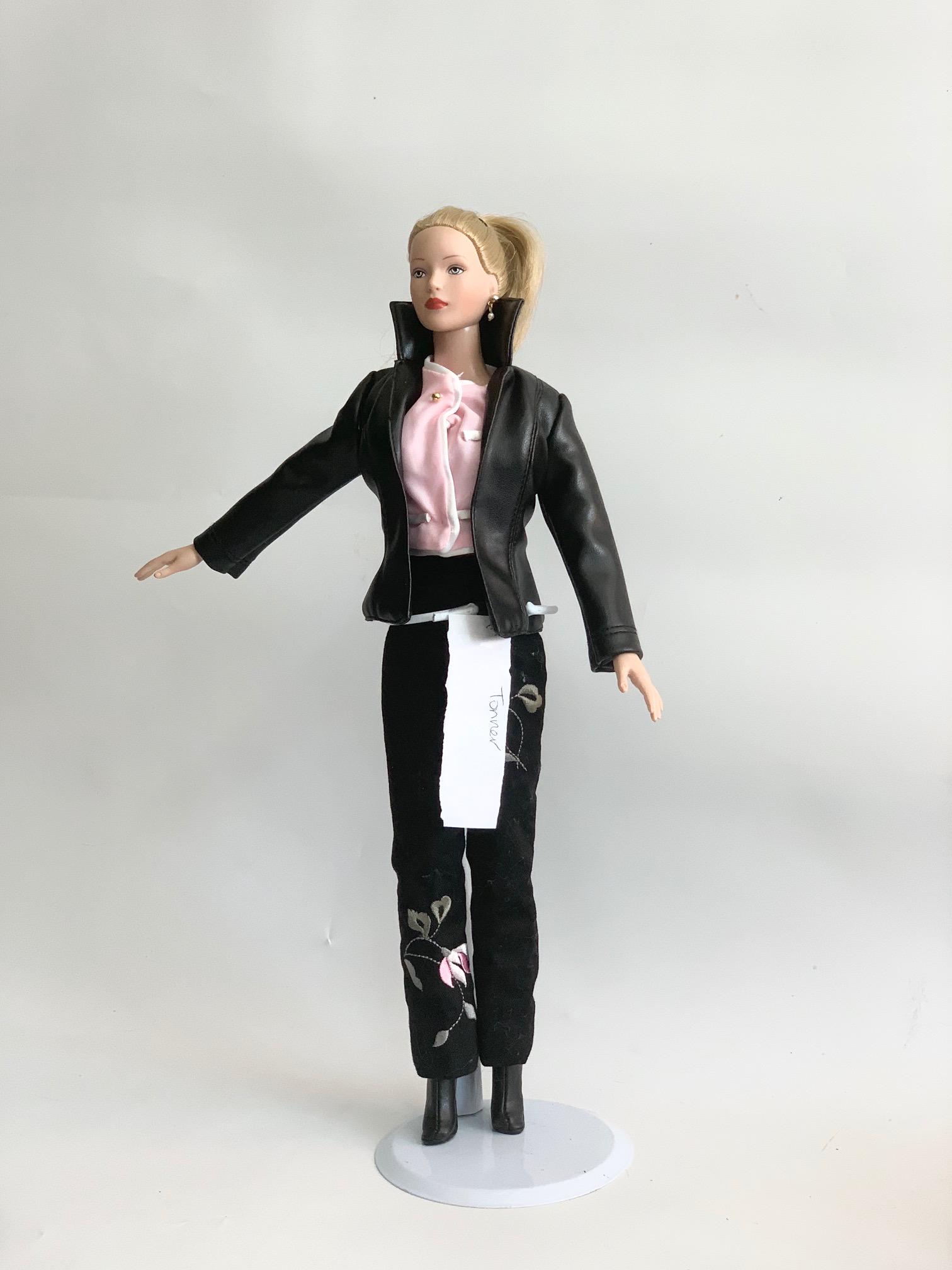 FB-15" Tonner Doll Leatherette Jacket Doll: 15" Tonner Doll with original black Leatherette jacket; pink top and black pants with embroidery; has shoes; blonde pony tail. We do our best to list all possible flaws, these are vintage/antique doll