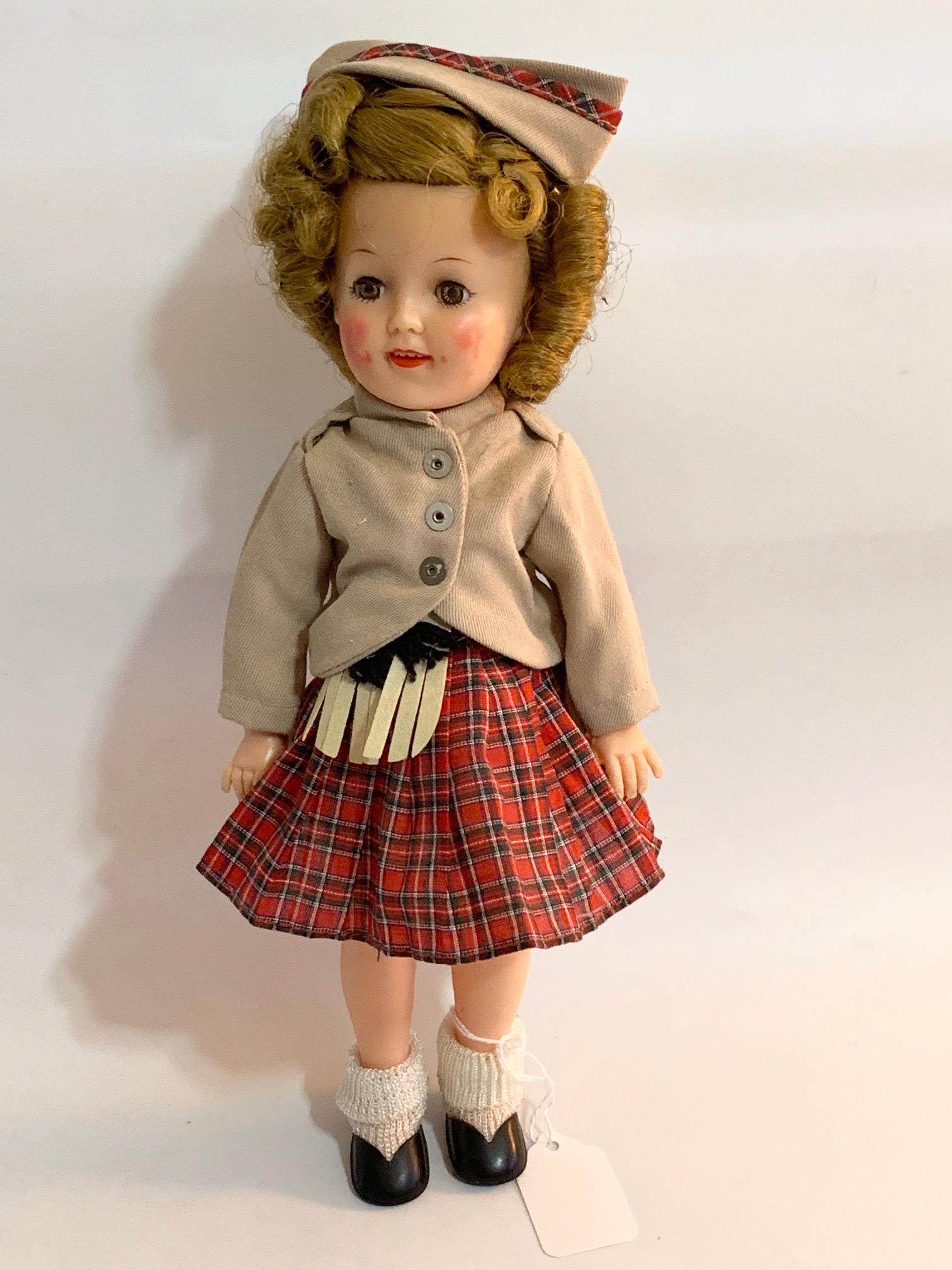 FB-Shirley Temple Wee Williy Winkie 12" Vinyl 1957: Shirley Temple Wee Willy Winkie 12" Vinyl Doll; 1957 Issue; all original tagged dress, with shoes; original wig. We do our best to list all possible flaws, these are vintage/antique dolls and are NOT 