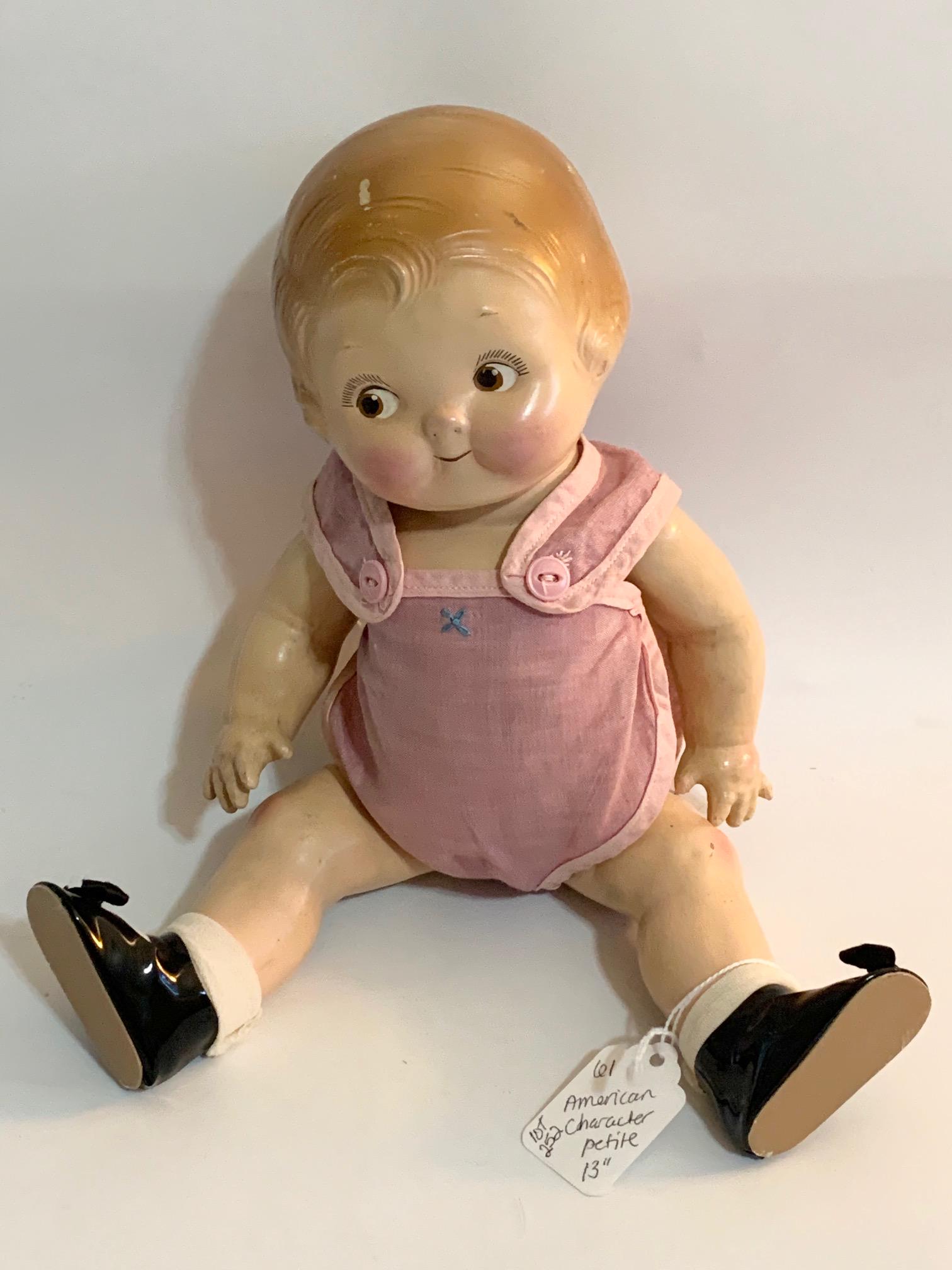 B20: Campbell kid American Character Petite 13": Campbell Kid American Character Petite; 13", googly eyes; old faded blue/purple playsuit; replaced shoes; molded hair. We do our best to list all possible flaws, these are vintage/antique dolls and ar
