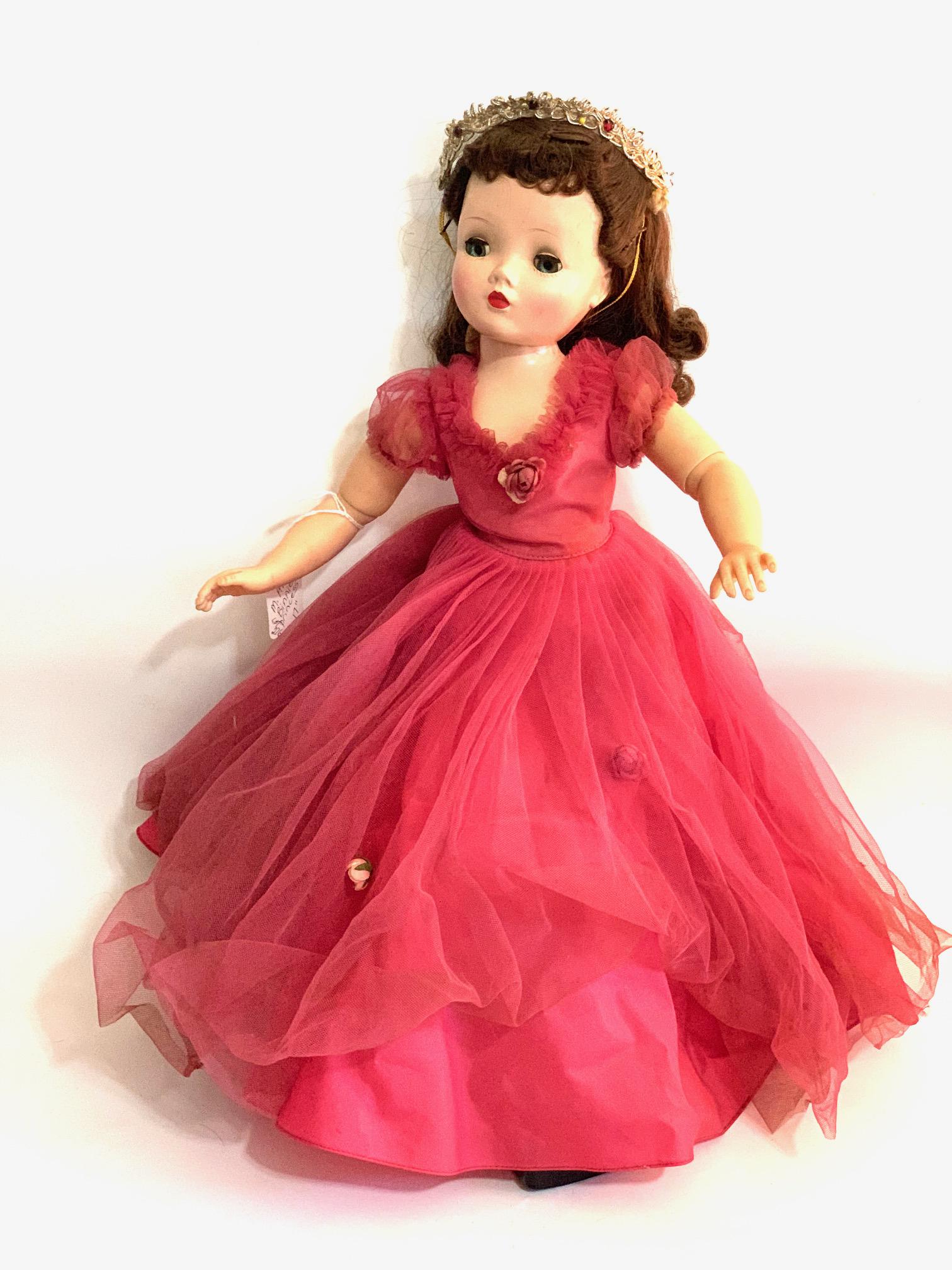 B21: Madame Aexander Girl Binnie Walker with Cissy Face: Madame Alexander Girl Binnie Walker with Cissy Face; 17" Hard Plastic; jointed body origina tagged Princess style dress with Tiara/ Crown; original wig. We do our best to list all possible flaws, thes