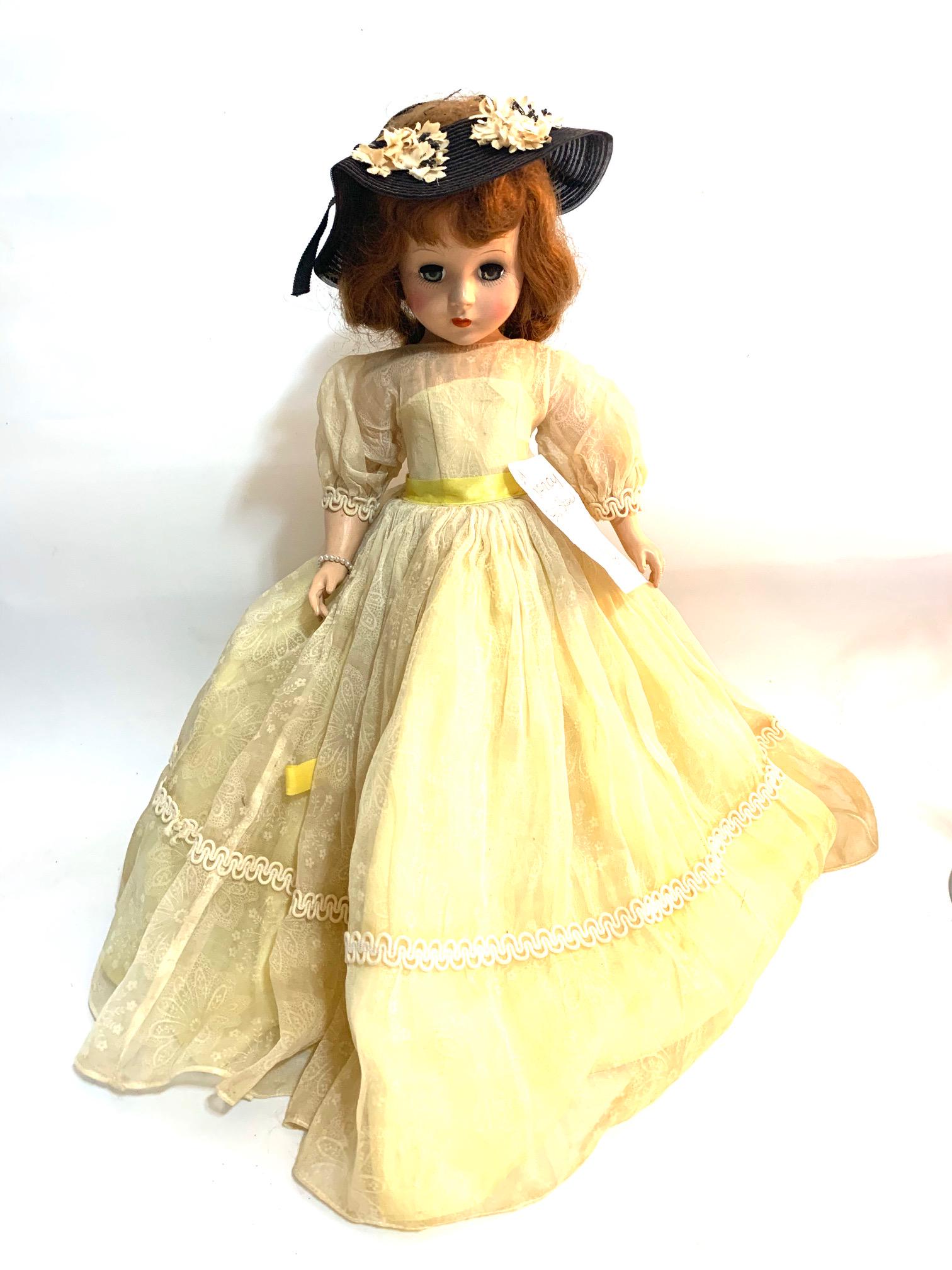 B22: 1904 Garden Party Style Show Nancy Ann 18" Doll: 1904 Garden Party Style Show Nancy Ann Story Book; 18" Hard Plastic Doll; Original yellow gown with floral pattern; and yellow ribbon sash; with black straw hat (that is Style Show hat but may not be 