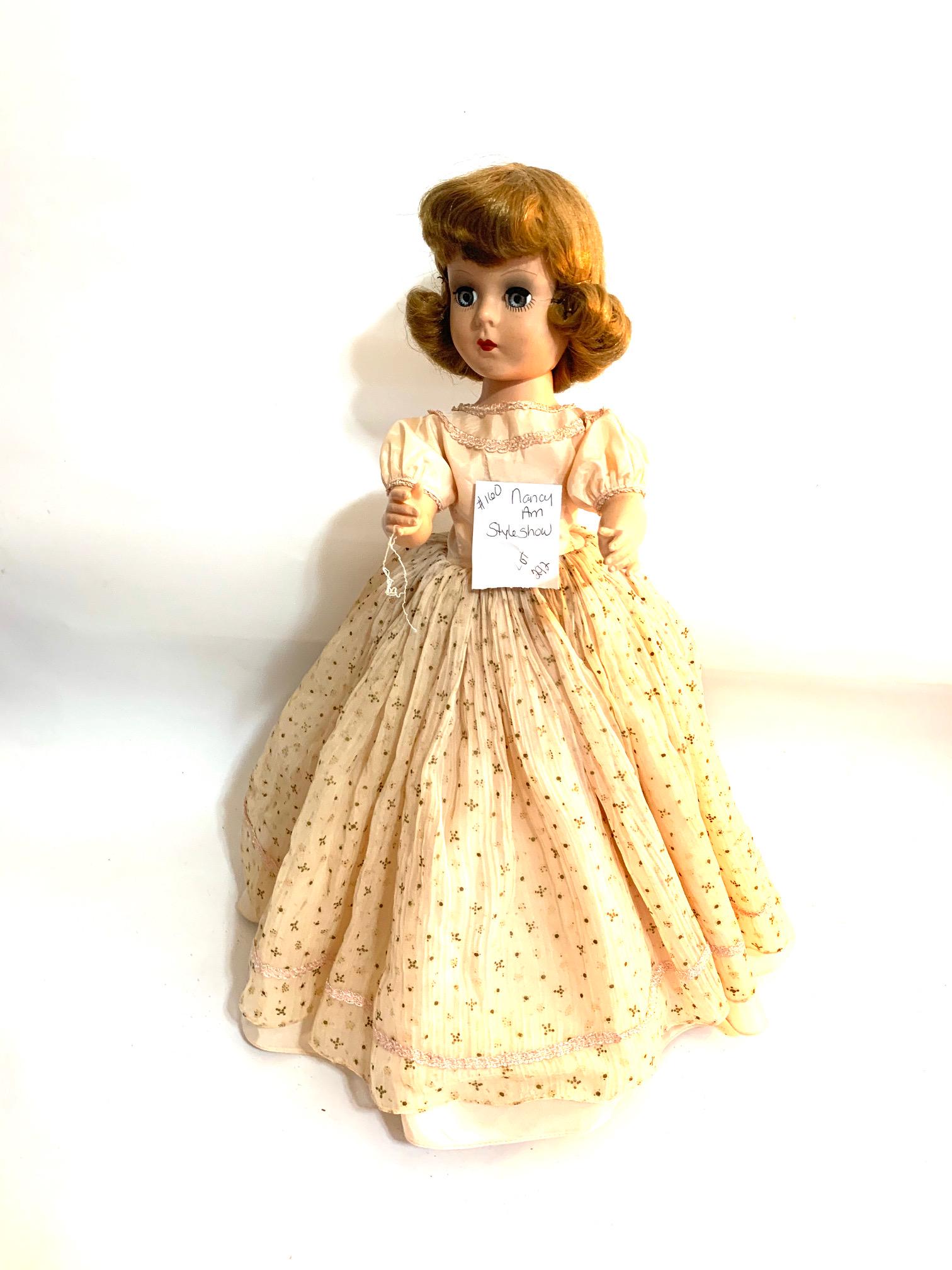 B22: Nancy Ann Story Book-Walker Style Show 18": Nancy Ann Story Book-Walker Style Show 18" Hard Plastic Doll; original pale peach taffeta dress with trimmed neckline and cap sleeves; organza overskirt dotted with gold stars; original synthetic wig.