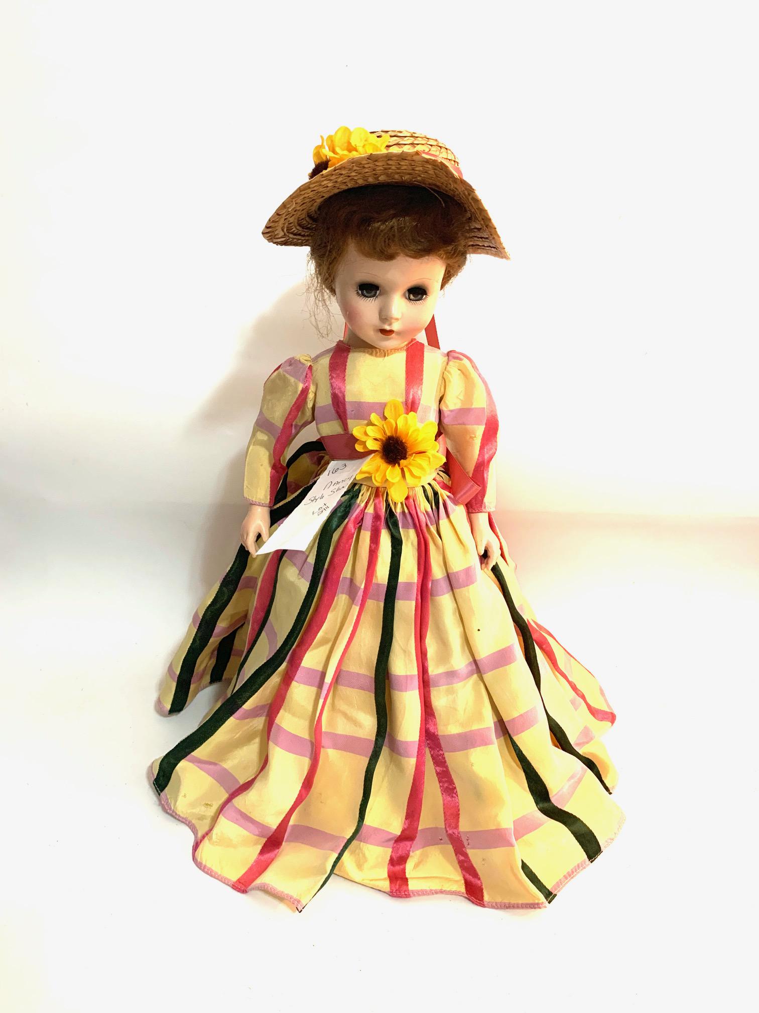 B22: Nancy Ann Story Book Summer Day Style Show 18": Nancy Ann Story Book Summer Day Style Show 18" Hard Plastic doll; original yellow dress with pattern of red and pink stripes; ribbon waist band with sunflower; straw hat with sunflowers and shoes; ori
