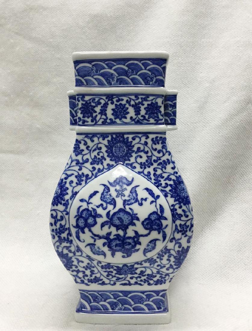 CHINESE PORCELAIN BLUE AND WHITE FLATTEN SQUARE VASE: CHINESE PORCELAIN BLUE AND WHITE FLATTEN SQUARE VASE. Six character marker on bottom. H. 24 cm. Domestic shipping $50 and oversea $100. Combined shipping available.