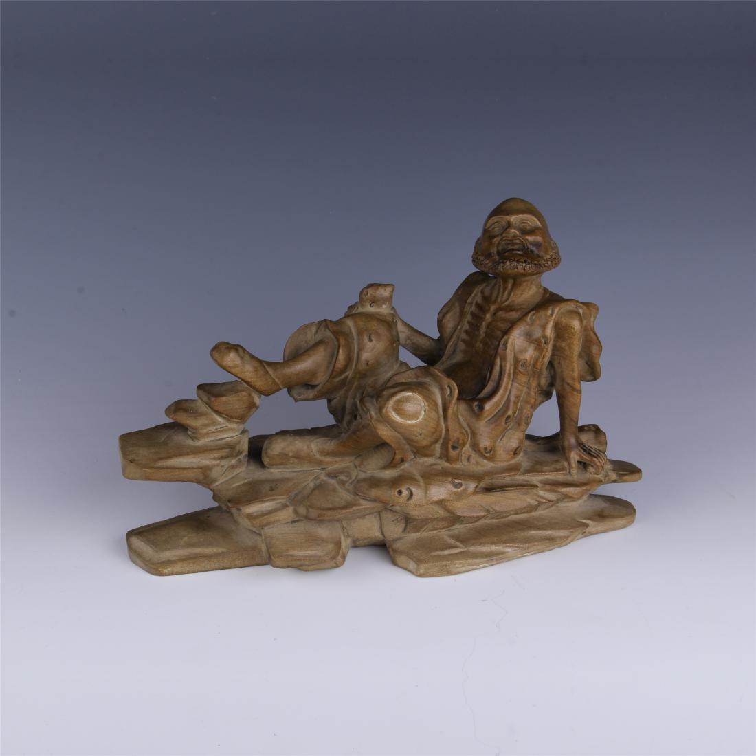 CHINESE SPRUCE WOOD CARVED COUCHING LOHAN: CHINESE SPRUCE WOOD CARVED COUCHING LOHAN. H . 17 cm. L. 25 cm. Domestic shipping $20 and oversea $60. Combined shipping available. Local pickup at our NJ warehouse available. Contact us in advance if