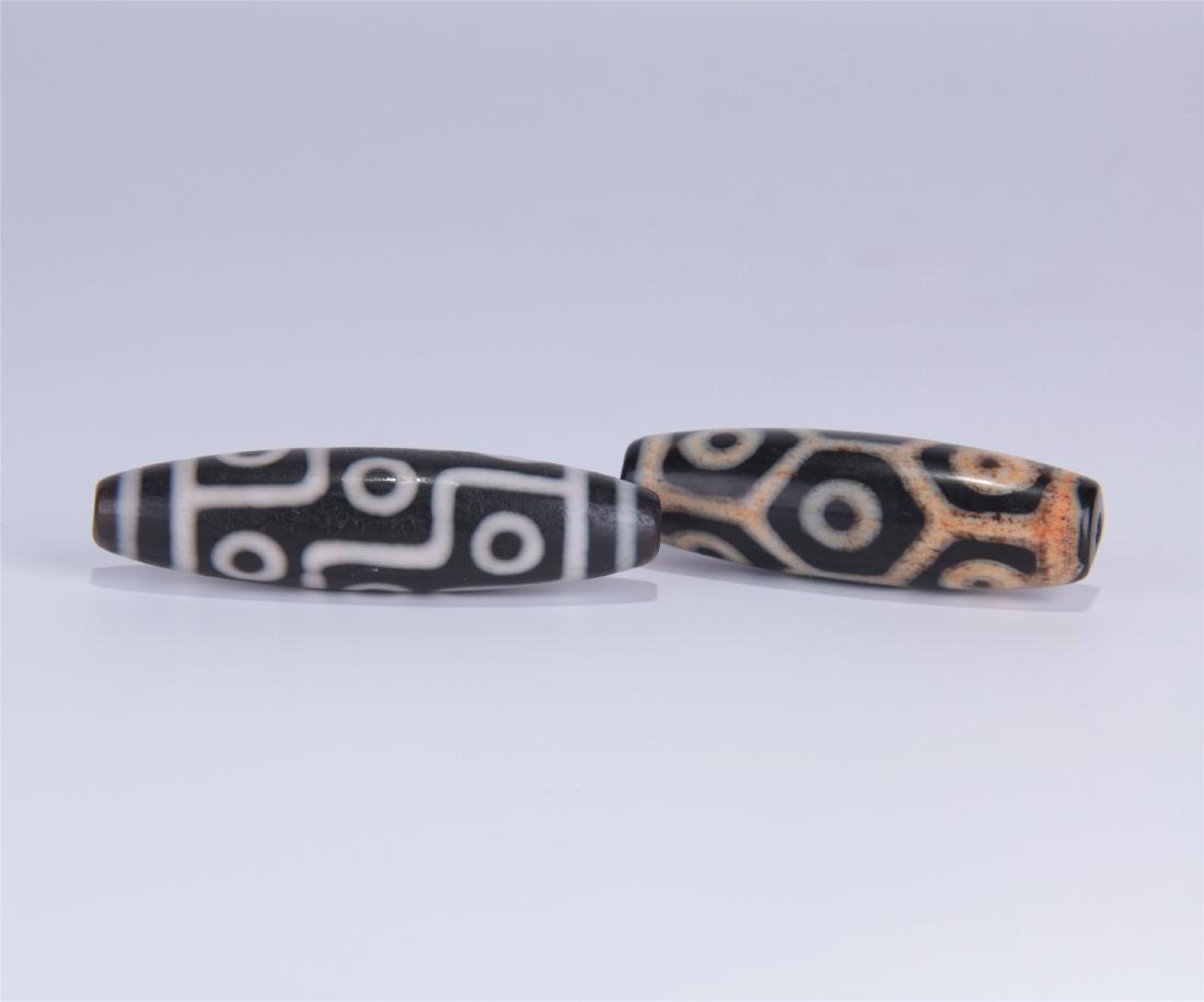 TWO TIBETAN DZI BEADS (1 of 5)