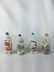 FOUR CHINESE PORCELAIN FAMILLE ROSE SNUFF BOTTLES