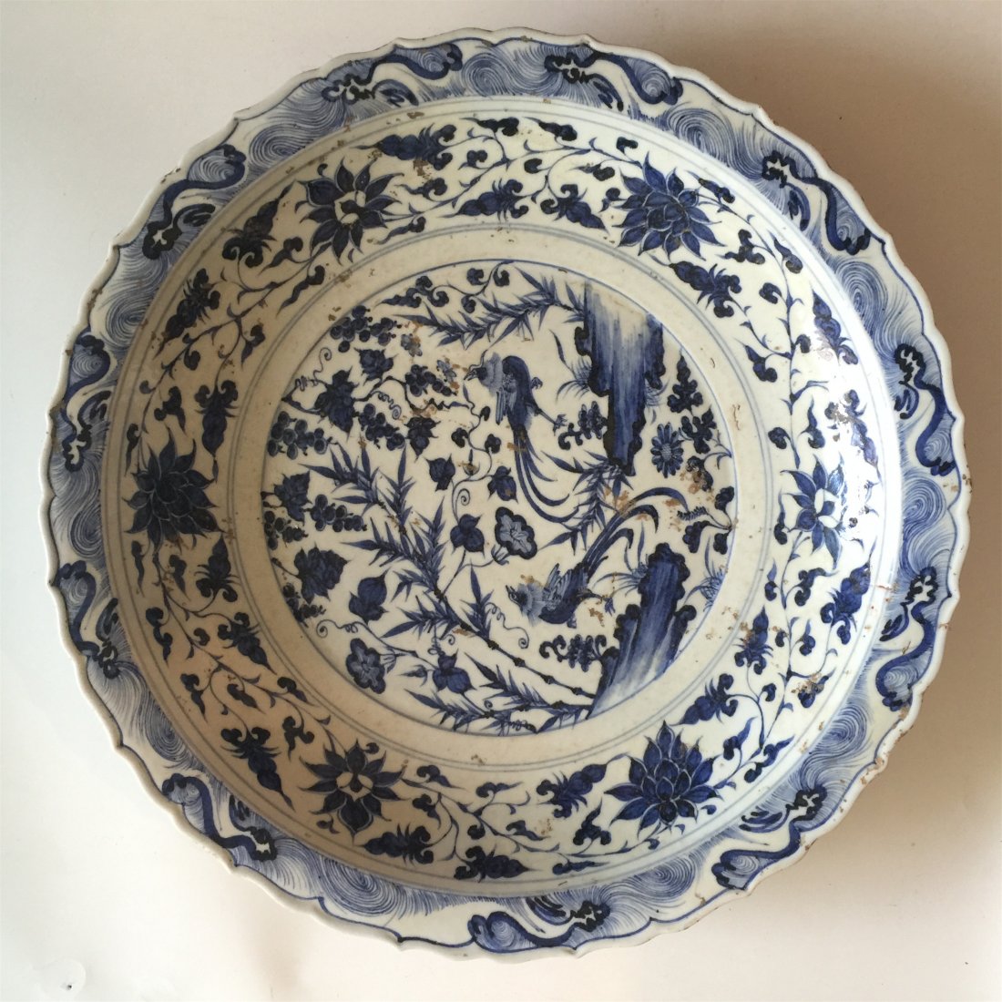 LARGE CHINESE PORCELAIN BLUE AND WHITE BIRD FLOWER: LARGE CHINESE PORCELAIN BLUE AND WHITE BIRD FLOWER CHARGER. Preharps Yuan or early Ming dynasty. H. 6.5 cm. Diam. 46 cm. Domestic shipping $250 and oversea $500. Combined shipping avaliable.