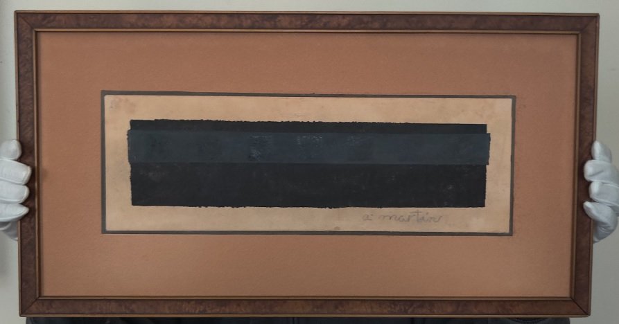 Agnes Martin oil on old paper: Agnes Martin oil on old paper glued on carboard, signed lower right corner, framed with a vintage wooden frame Bakelite design and protected by glass. Dimensions unframed: L 15 x H 5 inches, framed L 