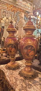 Pair of French porcelain, bronze mounted vases on bronze bases with covers: Pair of French porcelain, bronze mounted vases on bronze bases with covers. Dimensions: diameter 12 (14 with handles) x H 36 inches (This lot is for Pair of French porcelain vases only, other