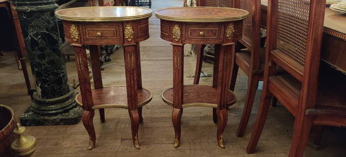Pair of French Louis XV style, oval end tables: Pair of French Louis XV style, oval end tables with inlay, drawer, bronze mounted and stretcher. Dimensions: L 16 x W 16 x H 50 inches. (This lot is for end tables only, other objects in the photo