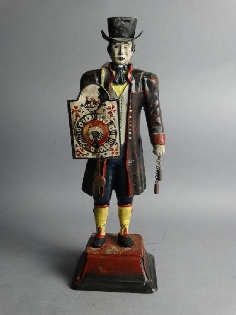 Antique Cast Iron Figural Key-Wind Clock: Antique Cast Iron Figural Key-Wind Clock, depicting a man in Victorian attire. Size : 14.25" H