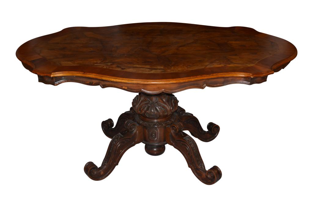 An Assembled Walnut Turtle Top Breakfast Table: 19th-20th C., the dramatically shaped top centering a large oyster veneer within a string inlaid border, raised on a large pedestal quadruped base w/ scrolled feet and flower chains. CONDITION: Expect