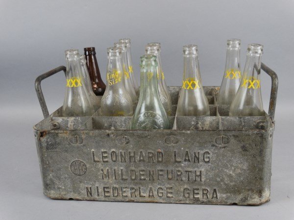 Lang Bottle & Carrier + Triple XXX Bottles: Lang Bottle & Carrier + Triple XXX Bottles Contains bottle from Gerhard Lang Brewery, vintage metal carrier from Leonhard Lang and collection of 12 XXX Root Beer Bottles. Size : 10"T x 17" L x 12.25" 