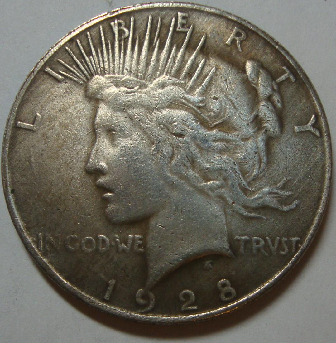 1928 Two Face Peace Dollar: NOVELTY. Both sides have heads.