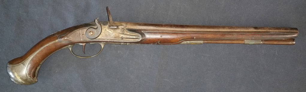 GEORGIAN ERA FLINTLOCK PISTOL: Flintlock pistol with Queen Anne era as well as Georgian Era characteristics. Typical fishtail shape with grotesque butt cap, inlayed wire scrollwork on stock and mixed metal decorative furniture on w