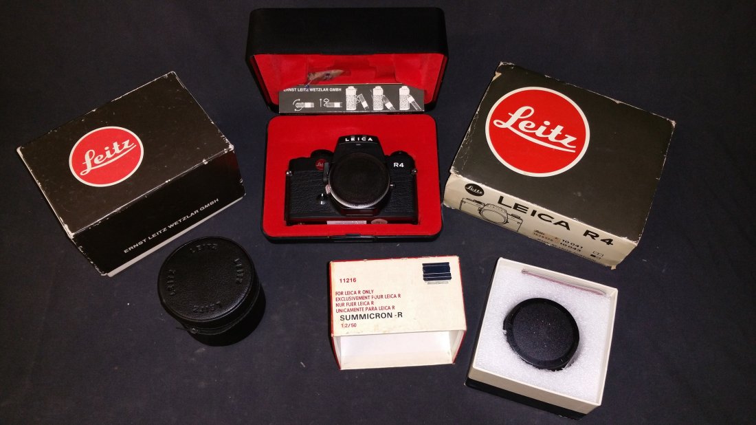 NOS Leica R4 Camera & NOS Leica Summicron-R, Elmarit-R: This is an amazing find! The lot includes NOS Leica R4 Camera & NOS Leica Summicron-R Lens, and a Elmarit-R Lens – ALL NOS IN ORIGINAL BOXES! Leica R4 Body Only SLR film camera. It is a reliable pie