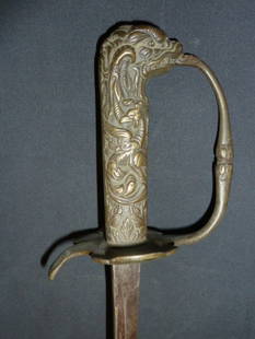 UNKNOWN SWORD | GRIFFON HANDLE | MARKED: Sword with Griffon or Dragon Metal Handle, perhaps brass. 33 1/2 inches long. Marking appears to be initials followed by an "55" diagonal.