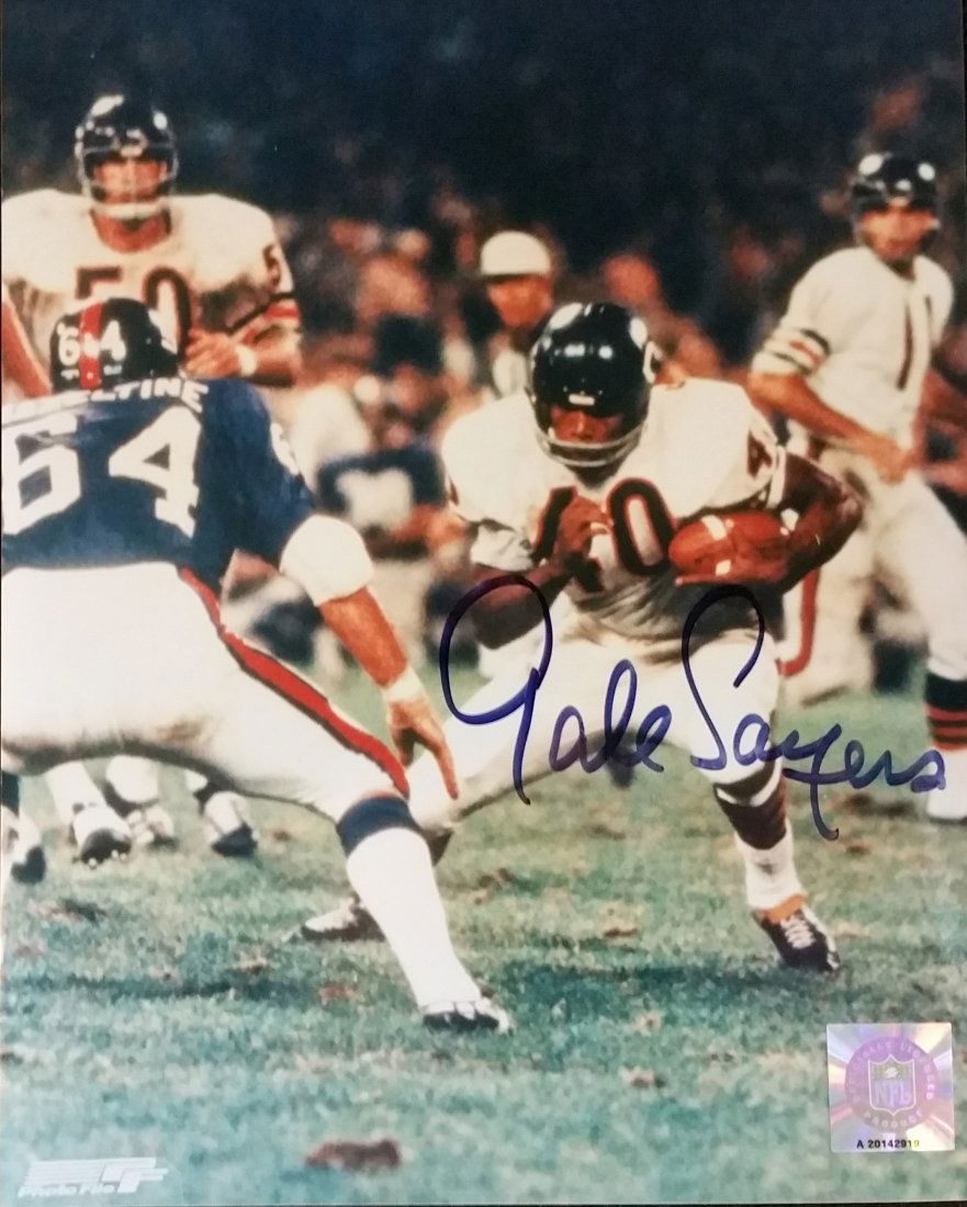 Gale Sayers – Chicago Bears- autographed 8x10 with COA: Gale Sayers – Chicago Bears- autographed 8 x 10 with COA8 x 10 color glossy photograph autographed across the legs of #40 “ Gale Sayers” in blue felt tip marker. Holographic Official NFL License