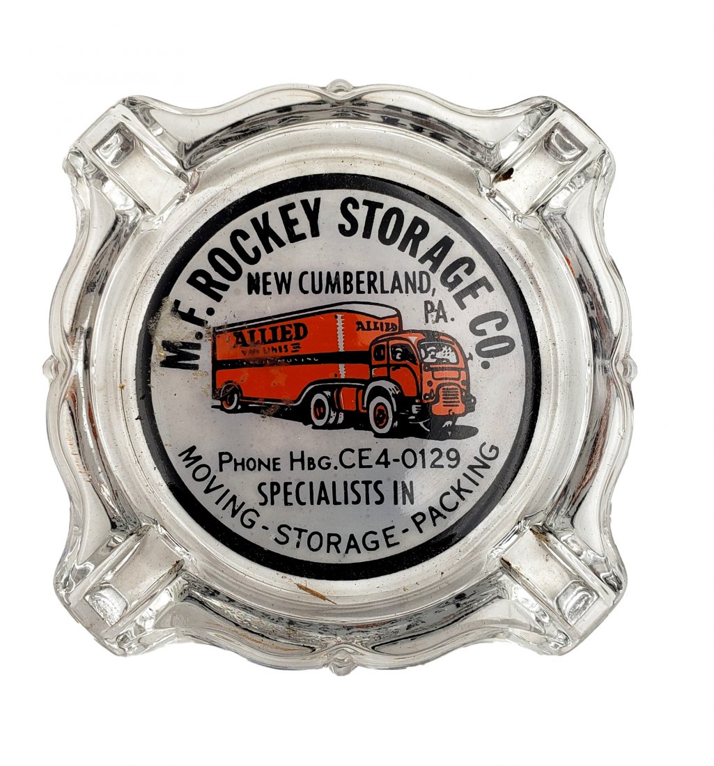 Vintage Allied Rockey Storage Glass Ashtray: Vintage Allied Rockey Storage Glass Ashtray. Vintage glass ashtray, New Cumberland PA, M.F. Rockey Storage Co. Clear graphics in black and orange. Very good used vintage condition. Size : 3.5 inches x