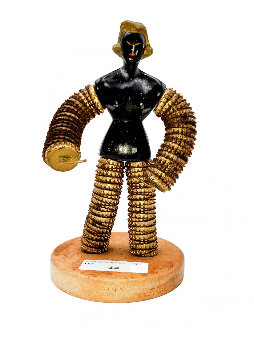 Metal Female Form, Bottle Cap Limbs, Art: Metal Female Form on wood base - Mixed Media. Black body. Head and torso from cast metal, stacked bottle caps over heavy gauge wire for limbs. Presented on a wood base. Details created with accent pai
