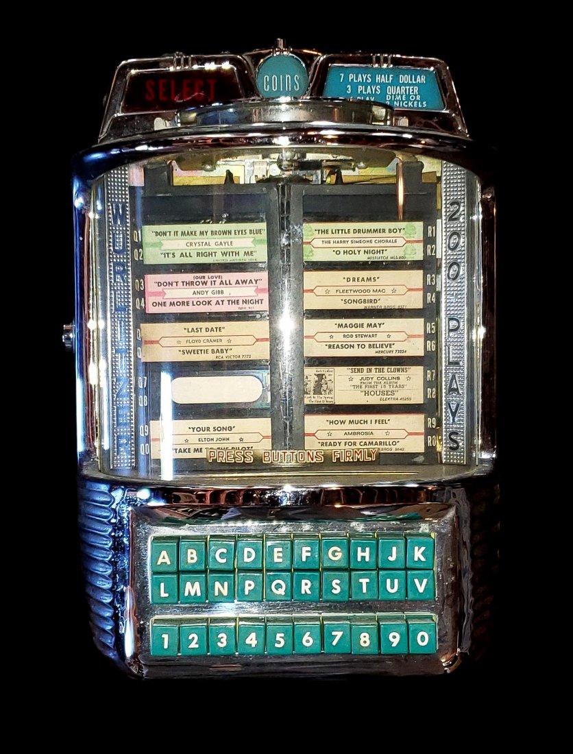 Wurlitzer 5250 Wallbox 200 plays - Circa 1958 Jukebox: Wurlitzer 5250 Wallbox 200 plays - Circa 1958 Jukebox. Fine condition vintage wall mounted table side diner jukebox. Key included. Chrome has minimal minor pitting in several spots. Not tested for use