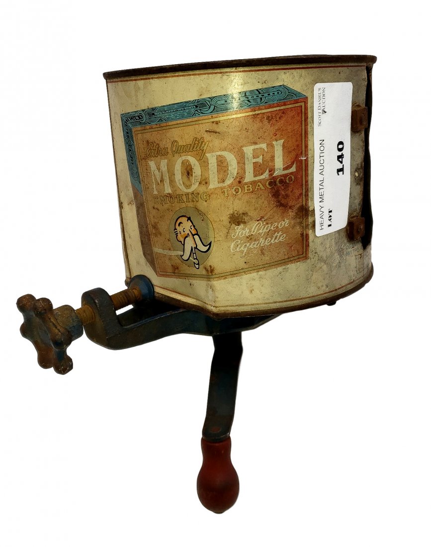Functional Tin Art - Model Smoking Tobacco Can Grinder: Functional Tin Art - Model Smoking Tobacco Can Grinder Wheel. Functional bracket mount separator/grinder wheel encased in modified tobacco can shield. Surface rust and patina of use. Still works. Size