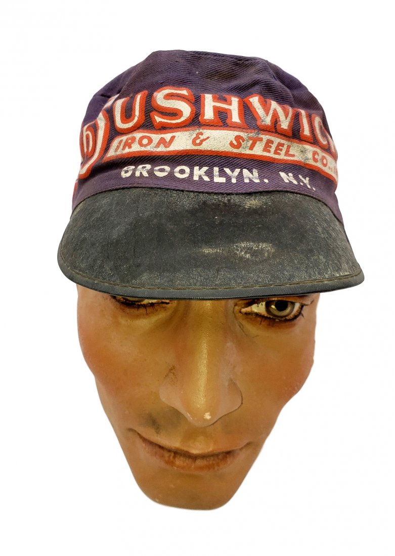 Vintage Bushwick Iron & Steel Co. Inc. Cap: Vintage Bushwick Iron & Steel Co. Inc. Cap. Believed to be a welders cap, made of cloth. Size 7 3/8 marked. All verbiage is easily readable and colors are still vibrant. Staining on top.
