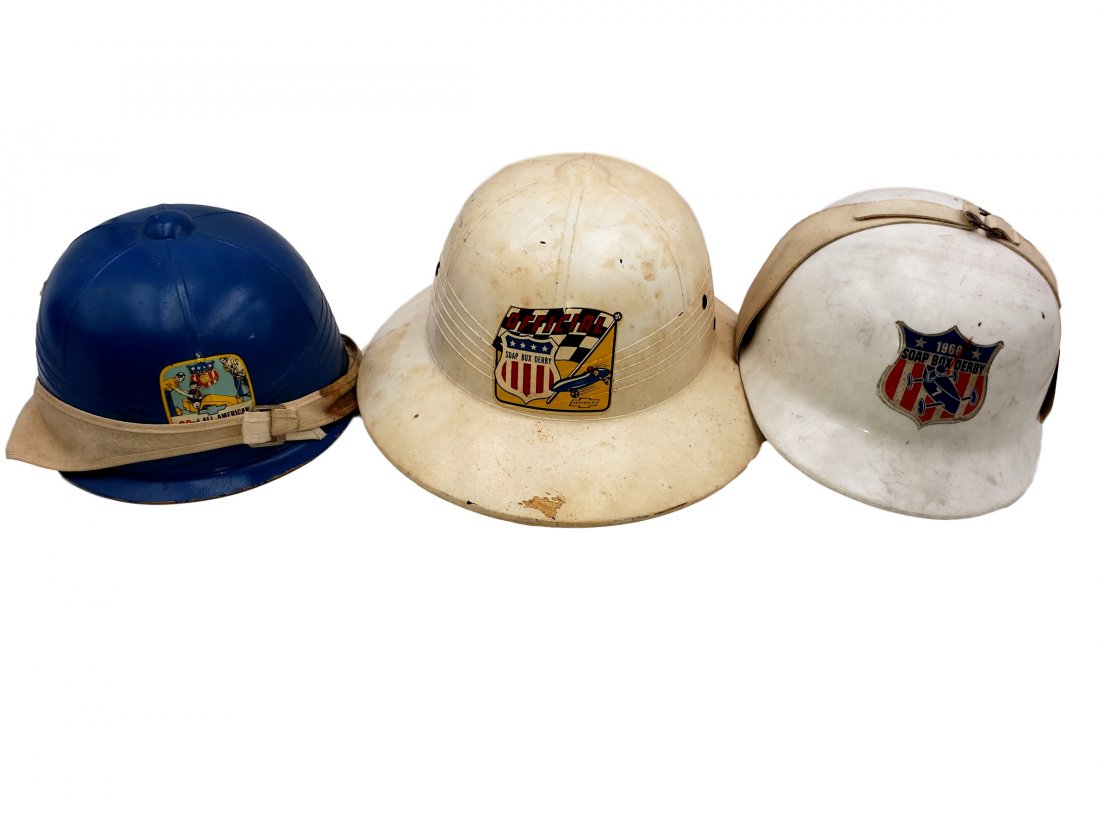 Three Authentic Vintage Soap Box Derby Helmets: Three Authentic Vintage Soap Box Derby Hats Helmets White Pith helmet style with official Chevy endorsed decal; Blue Bowl Style 1959 Official Helmet with decal and flannel chin strap; and Hunt Cap sty