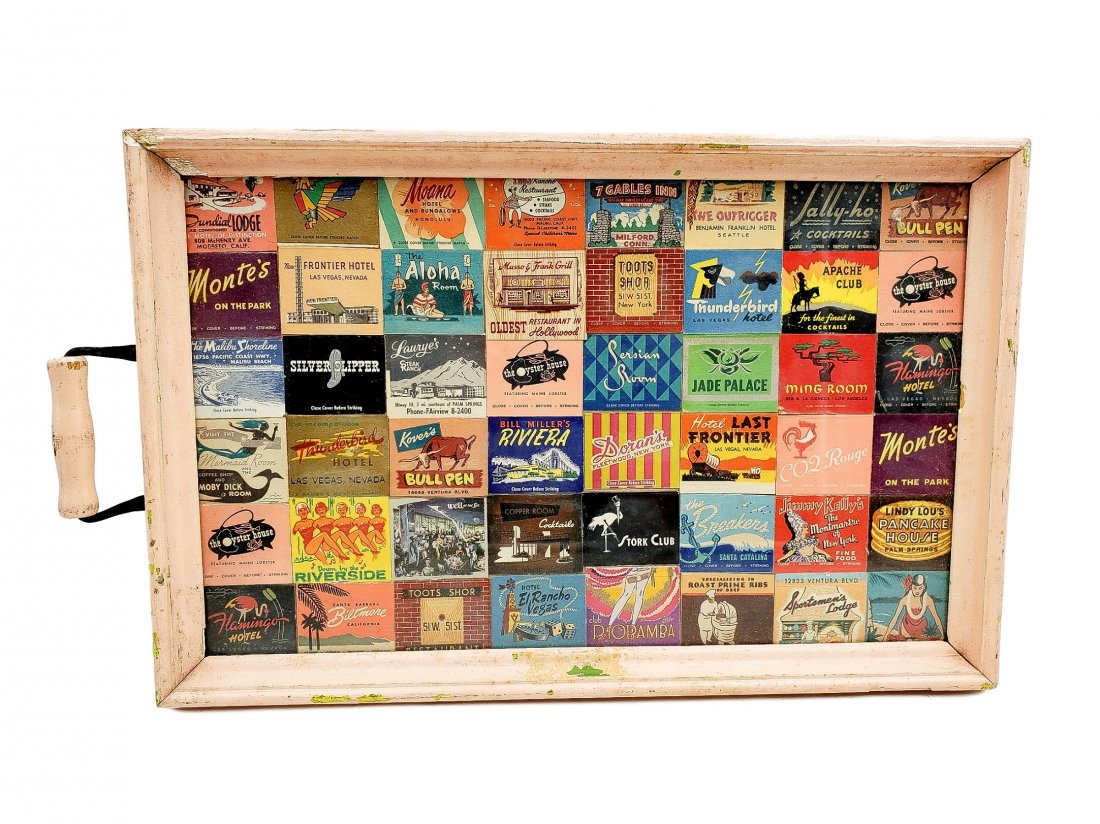Match Book Cocktail Tray - Vintage 1950s-60s: 48 matchbook covers presented under glass in a pale pink frame with a single wood grip handle on one end. 5 digit phone numbers and mid-century graphics place these Las Vegas, California, and other co