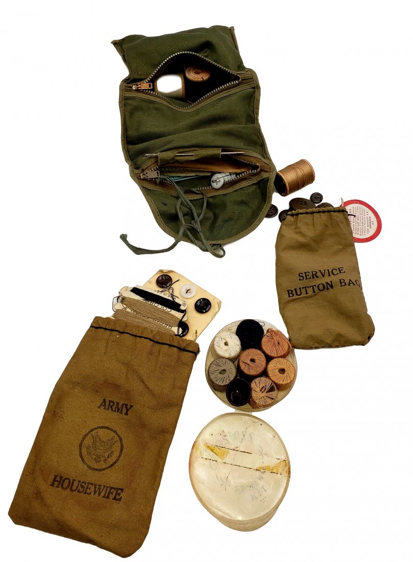 Army Wife Sewing Lot WWII Era: Darning and sewing repair roll-up kit, a bag of serviceman's buttons, " Army Wife" sewing kit bag, and Hostess Gift of thread spools in military uniform colors. Circa WWII era on all pieces. Items are