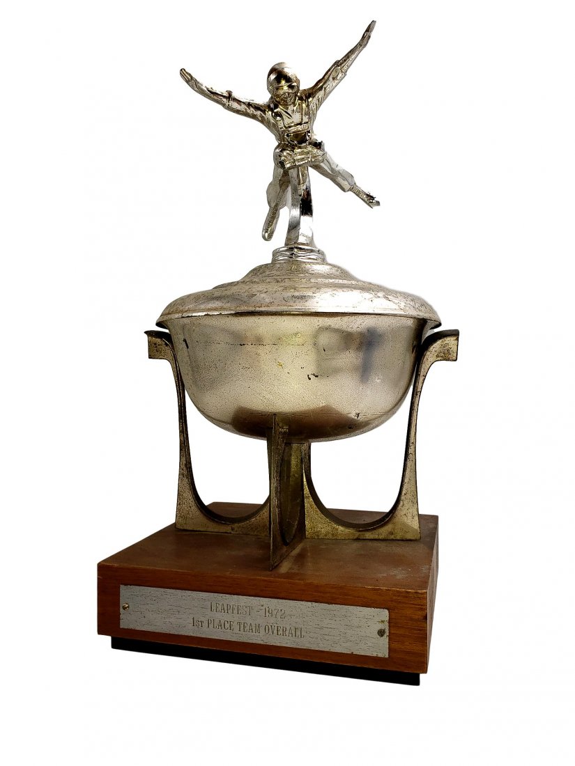 Leapfest 1972 First Place Skydiving Team Trophy: Leapfest 1972 First Place Skydiving Team Trophy"Fabulous Eagle Spread Parachute jumper figure trophy with mid-century stand on a wood base with a plaque that read “ Leapfest 1972; 1st Place Team Ove