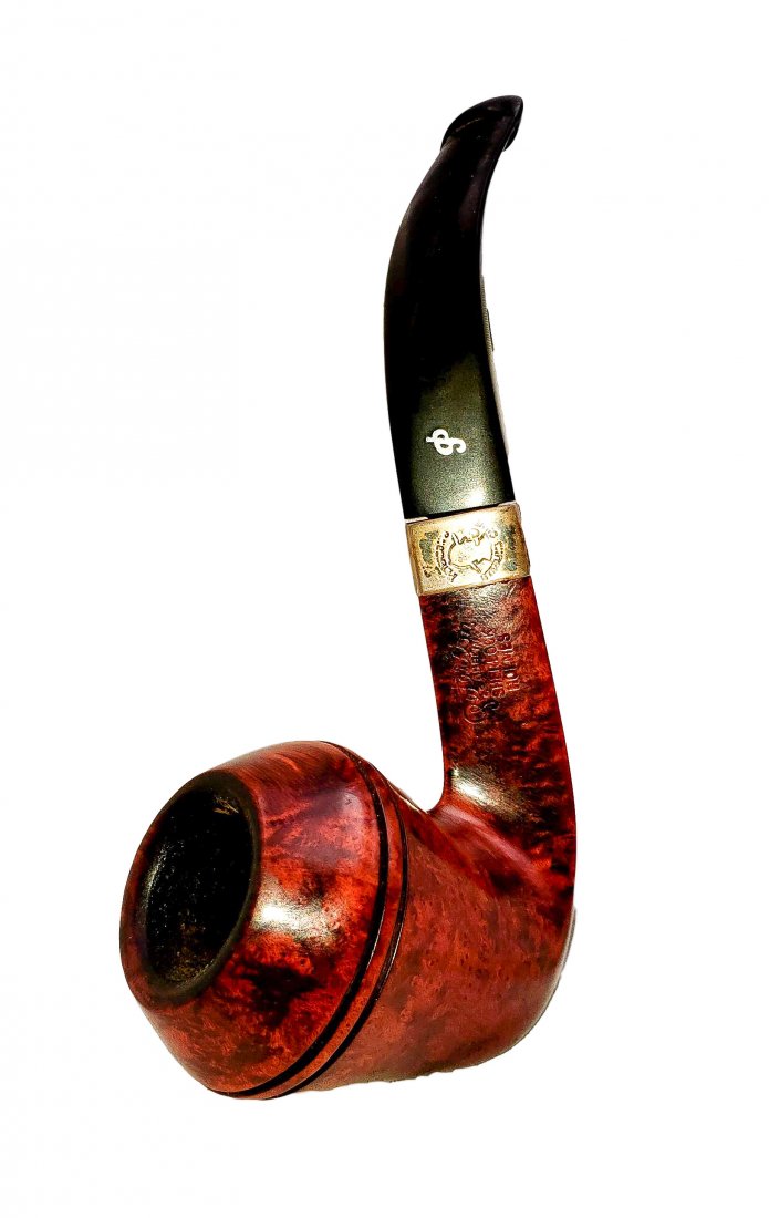 Peterson Sherlock Holmes : Hansom Sterling Band Pipe: Petersons Hansom Style Sterling Banded PipeSmooth finish warm tone briar, bent Bulldog shape/style bowl with a bent vulcanite stem, sterling silver banded at mount. Made in Ireland. Provenance The Bru