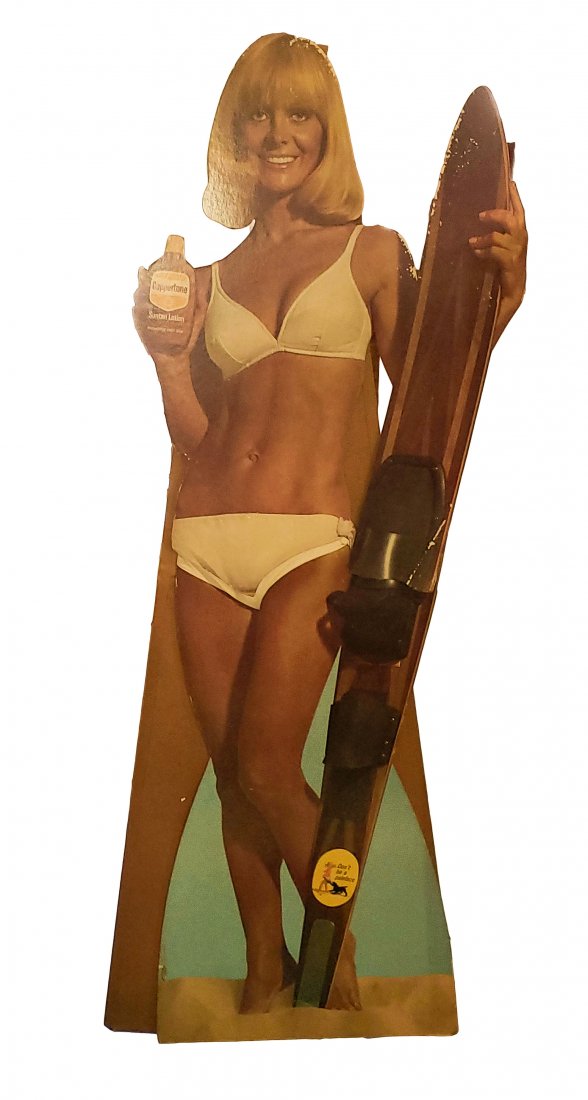 Advertising Coppertone Girl Stand Up Bikini Blond: Cardboard self-standing display advertising. Coppertone girl, blond with white bikini and water skis. Two-piece vintage sign with fold-out base stand. Assembled 65 inches high x 24 inches wide. Mild e
