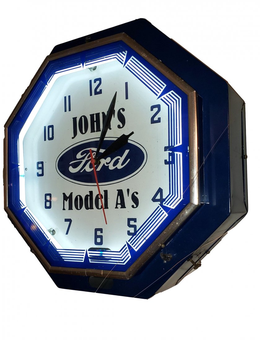 Offical FORD Neon Clock- Octagon: Vintage dealer / shop clock. Clock face reads - John's; FORD; Model A's - with deco style reverse painted octagon glass and chrome trim. The clock face has a white neon tube under glass to illuminate