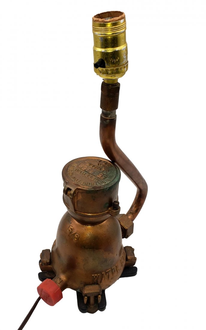 Water Meter Lamp - Unique Folk Art with Function: Lamp from copper pipe and a water meter. Working condition, clean intact wiring, and plug. 15 inches high ( with no shade) x 11 inches at the widest point.