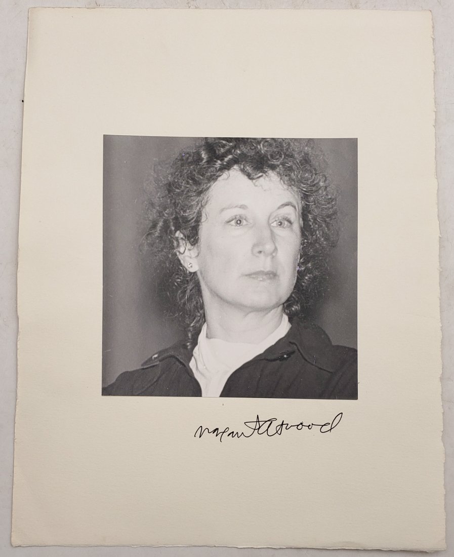 Margaret Atwood: Signed Photo Portrait: B/W photo of Margaret Atwood by P.Rankin- Smith mounted on art paper and signed on the margin by Margeret Atwood. The signature is authentic with provenance. Image size : 6.25 x 6.25 inches. Mount siz