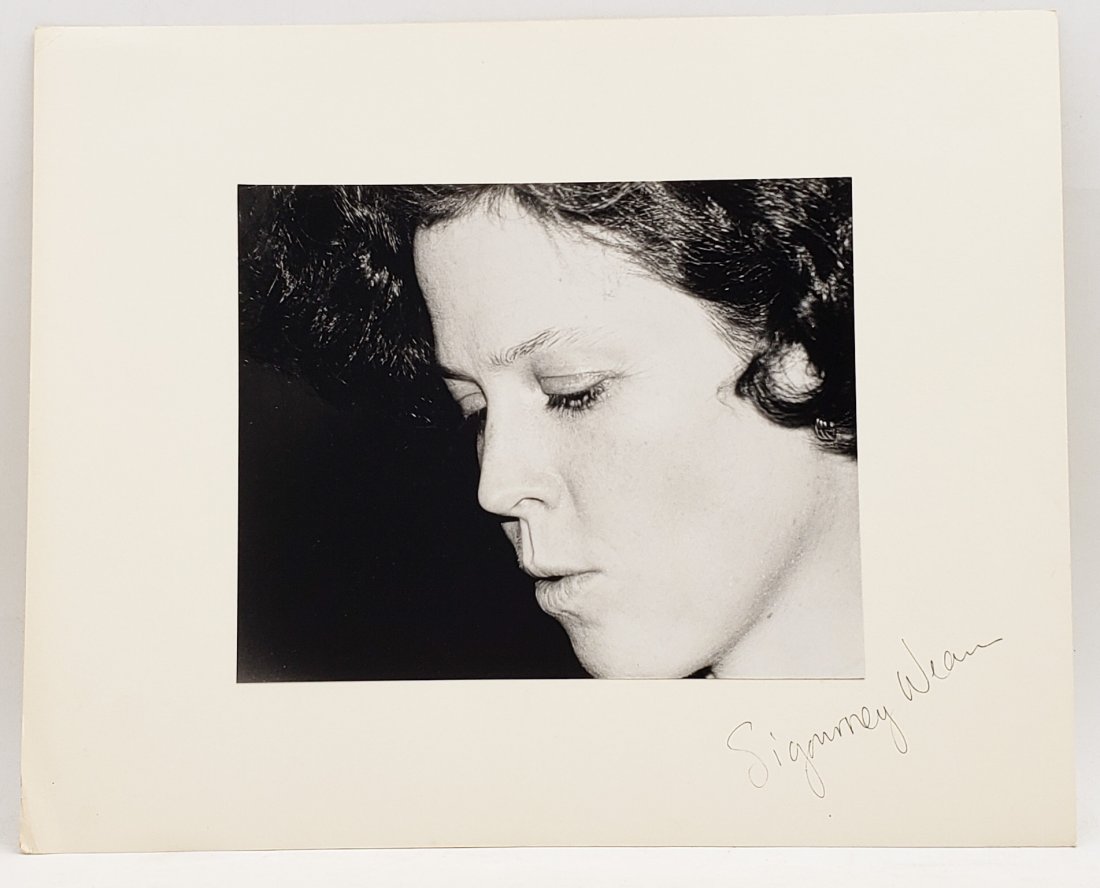Sigourney Weaver: Signed Photo Portrait: B/W photo of Sigourney Weaver by P.Rankin- Smith mounted on art paper and signed on the margin by Sigourney Weaver. The signature is authentic with provenance. Image size : 8.25 x 6.5 inches. Mount si