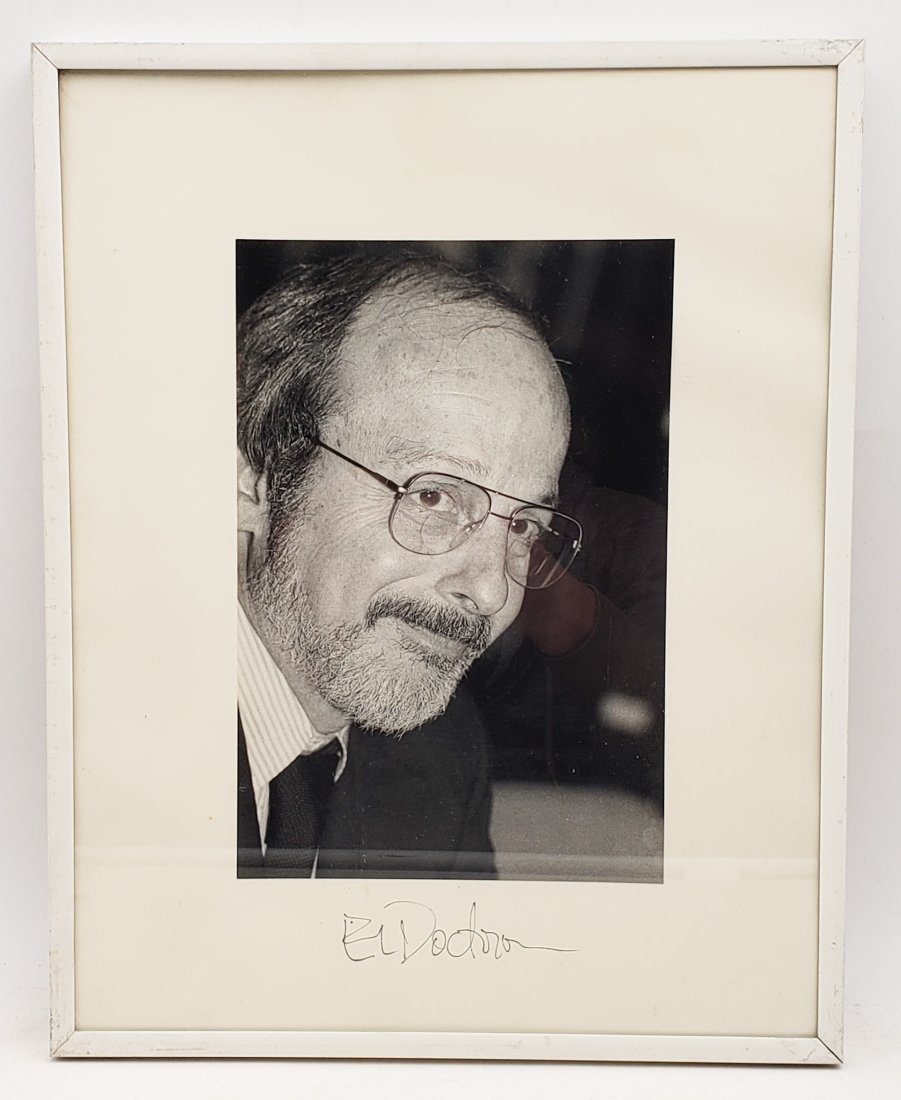 E. L. Doctorow: Framed Signed Photo Portrait: B/W photo of E. L. Doctorow by P.Rankin- Smith mounted on art paper /board and signed on the margin by E. L. Doctorow. The signature is authentic with provenance. Image size : 6 x 9 inches. Framed siz